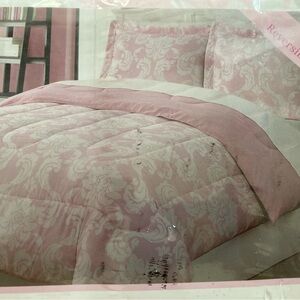 Pink and white floral twin comforter set. Never used, never out of the package